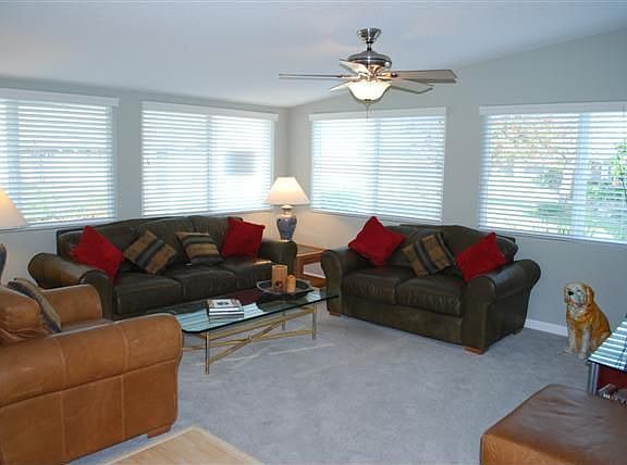 Vaulted ceilings accent this bright airy living room 