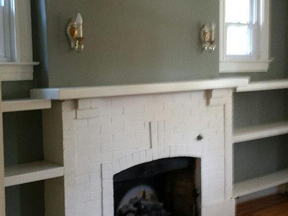 Living room ornamental fireplace with build-ins