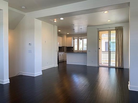 Main living room, with balcony off the kitchen, located on 2nd floor
