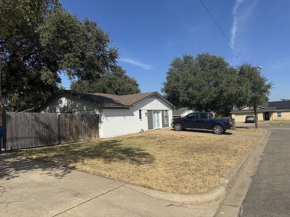 Side Yard of Home with large pasture gate entry to backyard, Side Street of Vail Highlands Circle