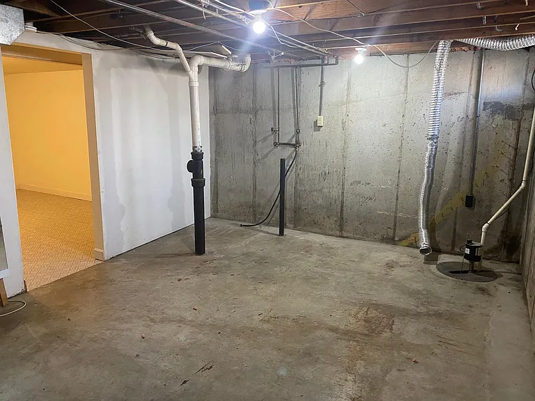Unfinished storage area with electric laundry hook ups
