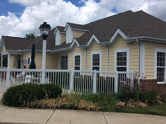Clubhouse connects to pool with exercise equipment room and separate social room