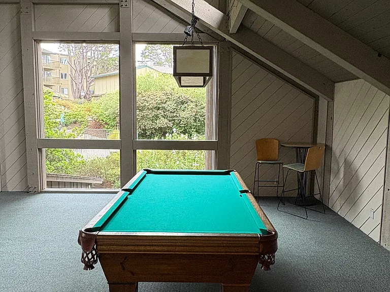 Pool room on the second floor with awesome views from the clubhouse windows