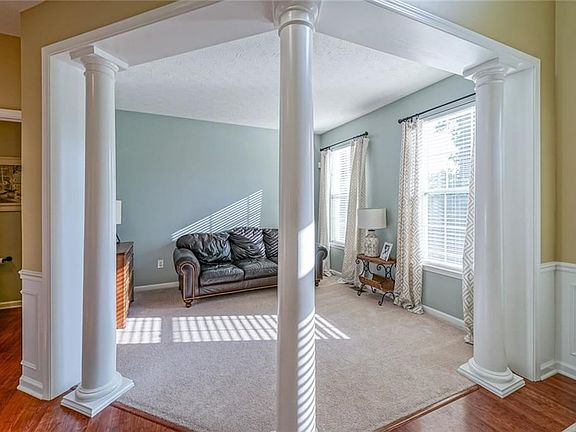 Notice the Gorgeous Pillars leading into the Living Room!