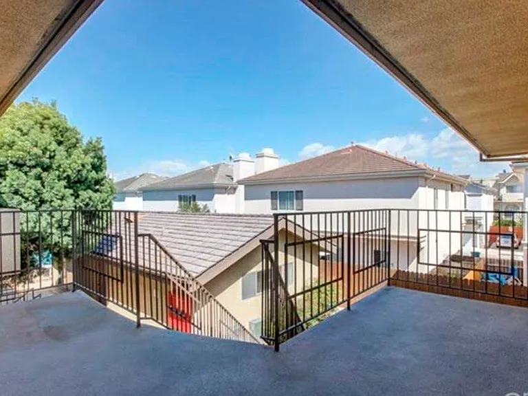Patio Area is to the left of shared walkway