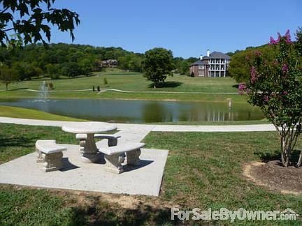 Photo from lower area of lot.
						:
						Walk around the lake, or to the stables!