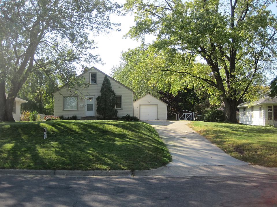 View of home, garage and shed from street