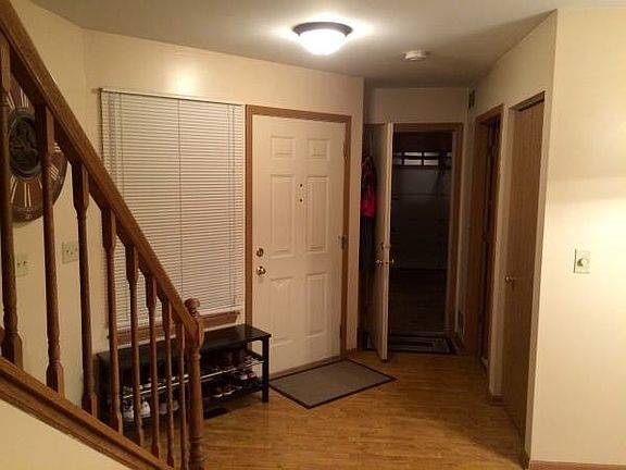 Foyer into the house with entrance to garage