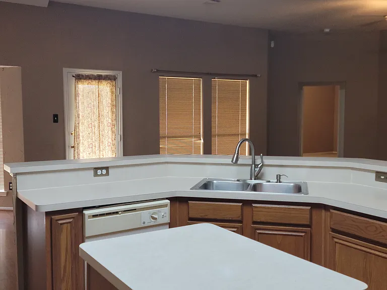 Inside kitchen looking out across island counter