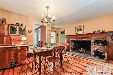 Pine floors, beautiful mantel, beautiful brick work