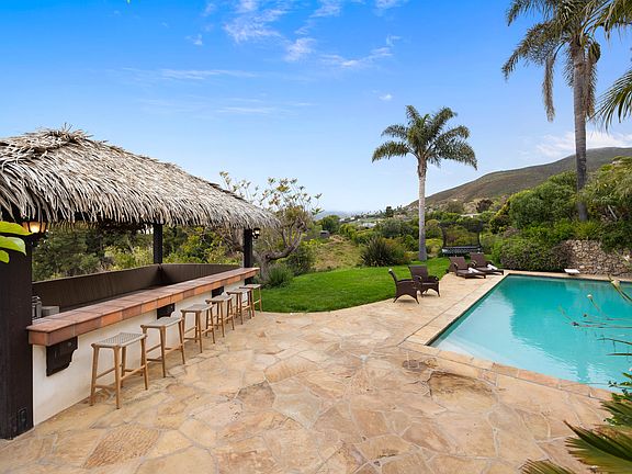 Unwind in style at the poolside tiki bar, offering a taste of paradise right at your fingertips.