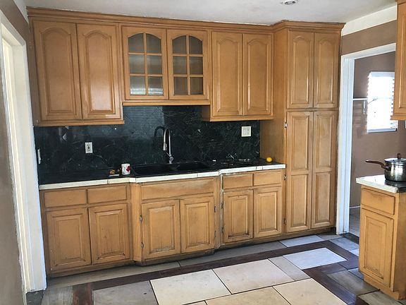 Kitchen counter and cabinet.
