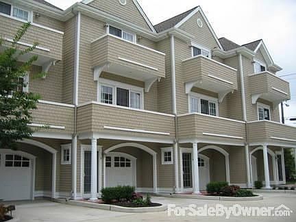 Exterior : Victorian style, cedar shingles, 2-car garage first level