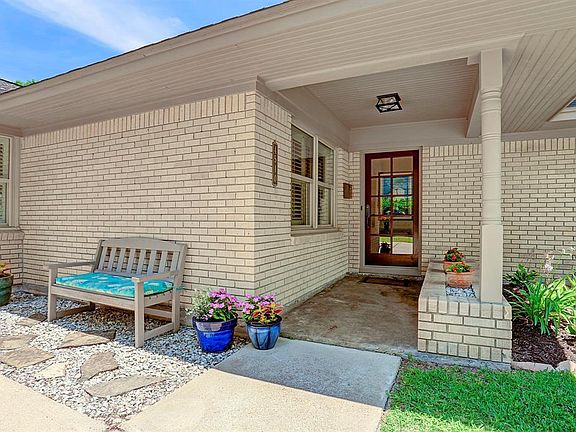 Inviting front porch entry. Undereaves lighting. Double-paned windows. Attic insulation. Nest Thermostat.