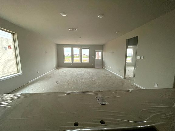 Construction progress - kitchen island overlooking dining and living rooms