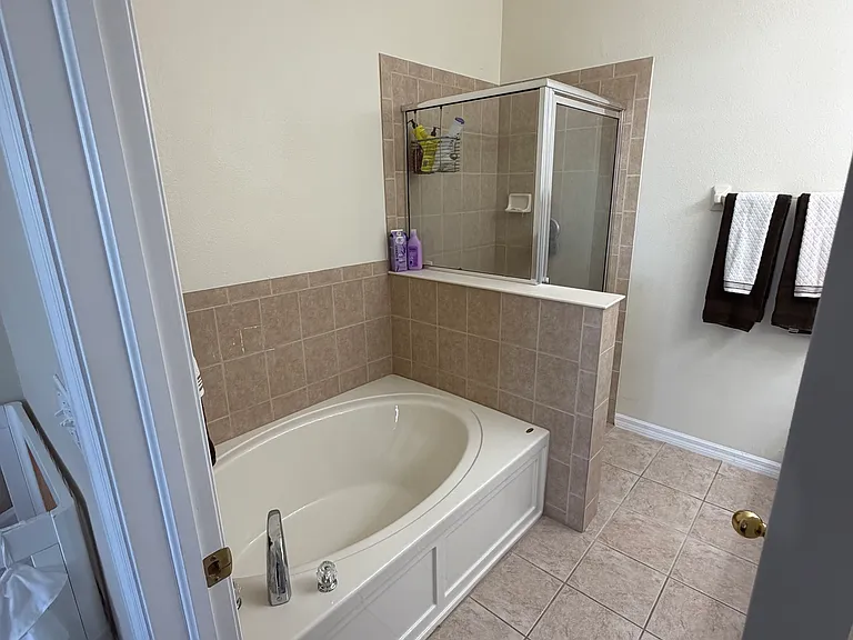 Master bathroom with bathtub and walk in shower