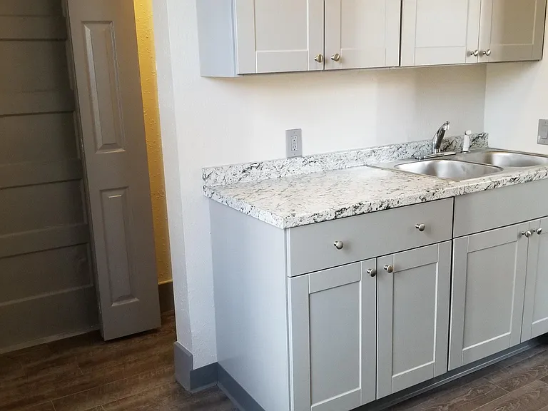 BEAUTIFULLY REMODELED KITCHEN WITH NEW CABINETS AND FLOORING