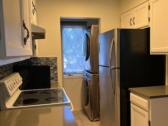 Washer/dryer, dishwasher, and refrigerator new within 2 years. Built-in pantry and generous cabinet space.