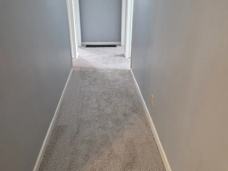 Hallway leading to 3 bedrooms and full bathroom