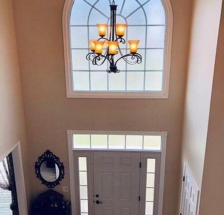 Spacious Two-story Foyer and Welcoming Front Door.