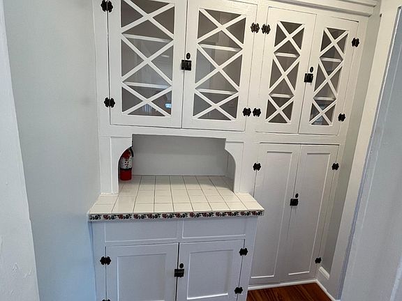 Quaint hand built pantry cabinets with room for ample storage