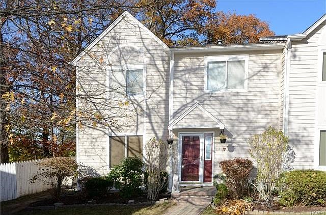 Welcome to 22 Hendrick Hills.  This beautifully updated end unit with private entry.