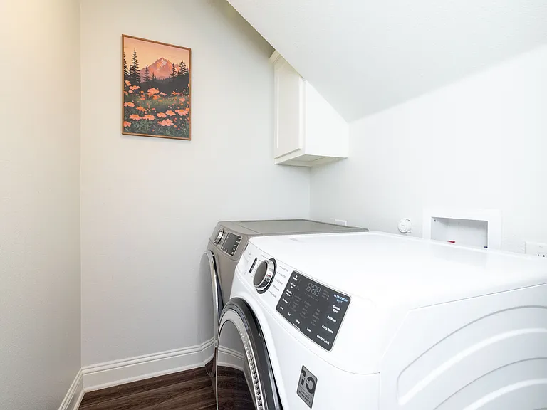 Convenient laundry room equipped with a washer and dryer_making long stays or travel light easy and hassle-free.
