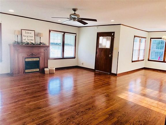 Look at these original wood floors!  They are throughout the entire home.  With updated vinyl windows galore- to let the sunlight in.