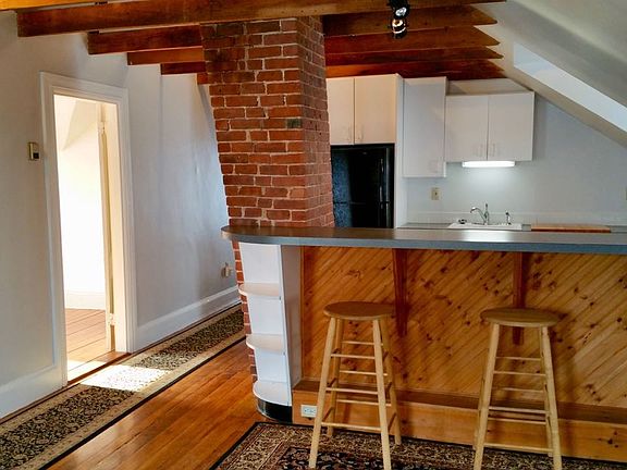 With exposed wood beams and beautiful hard wood floors this