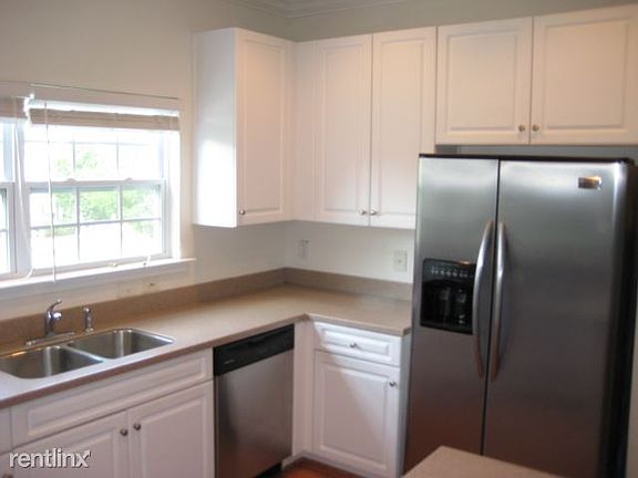 Corian countertops and stainless steel appliances