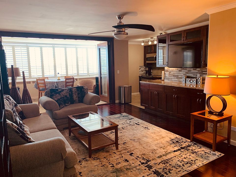 Spacious living area with enclosed lanai. Plenty of storage in cabinets and closets.