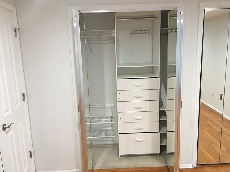 Master-Built in closet storage in twin closets