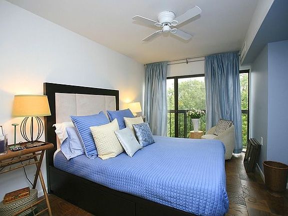 Good-size bedroom with tree views