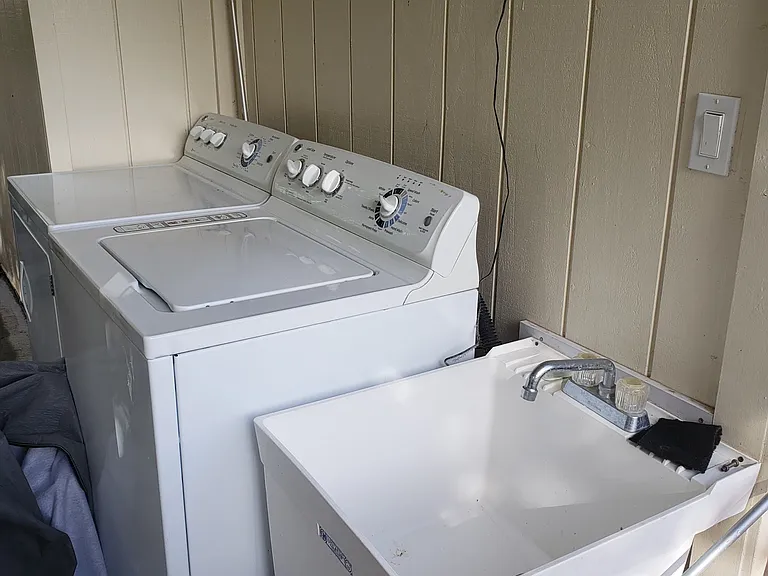 Washer and Dryer is outside but dedicated to this unit.