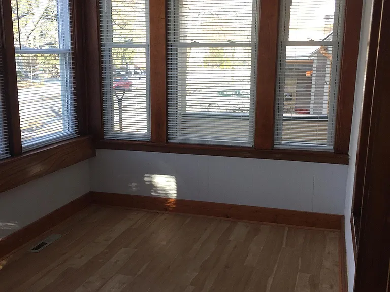 Enclosed, heated front porch
