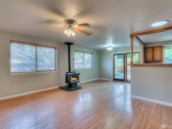 Propane Stove will provide heat in those colder season, solar tube provides more light.  Great open concept living with sliding 