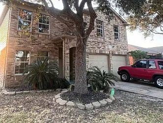 Front exterior of the home on a corner lot.