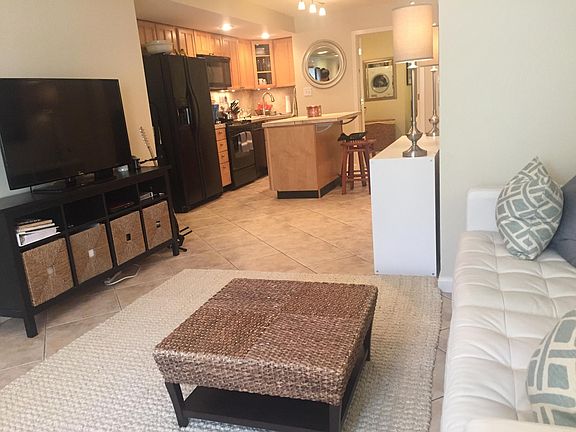 Living room and kitchen -- seen furnished