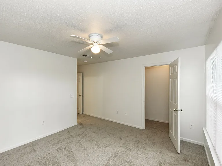 Bedroom with carpet & ceiling fan