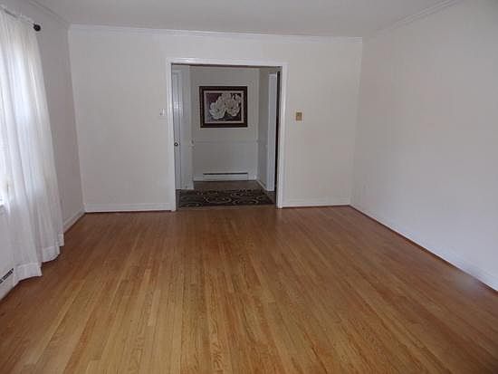 Large Living Room with hardwood floors; can be used as dining room (i.e., Thanksgiving family gatherings, etc.)