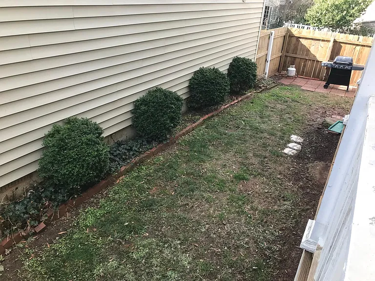 Side yard as seen from the front of the house.