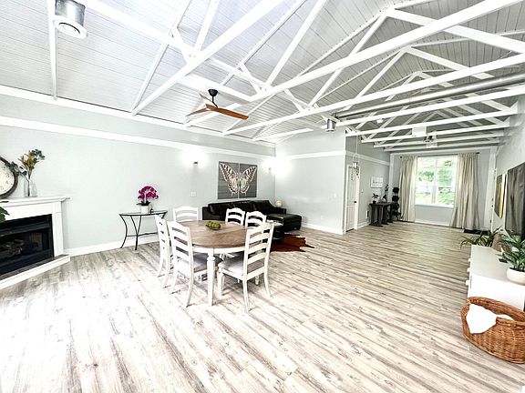 Spacious high ceiling open dining and living room area