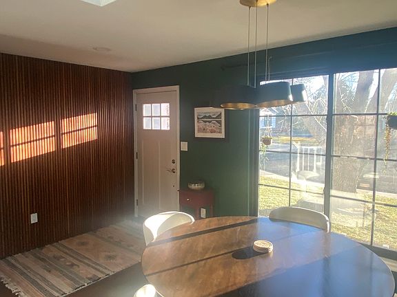 Morning light through the front window and skylights of the kitchen and eating area.
