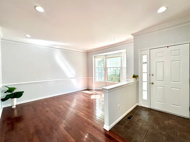Sun Filled Living Room with Foyer