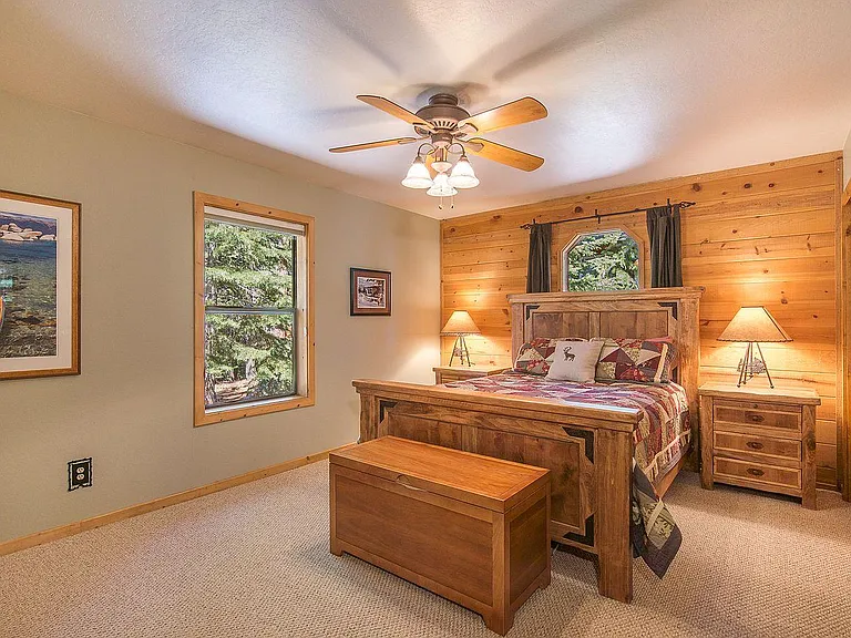 Bedroom 3 with new queen bed (2021) with double closet and en suite bathroom.