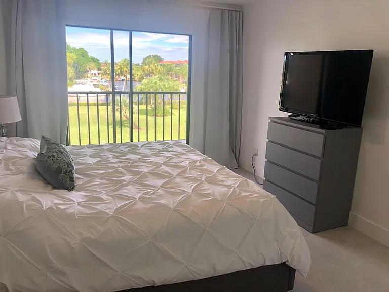 MASTER BEDROOM WITH FLAT SCREEN TV