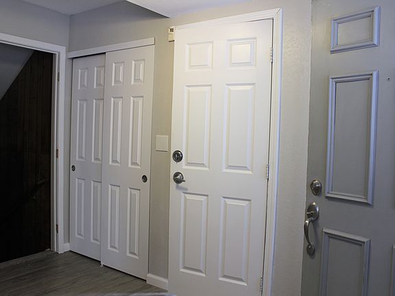 Entry Way 1b - Coat Closet, stairs to basement