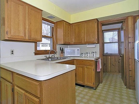 Close up of the kitchen.  Half bath through door at the back of the room