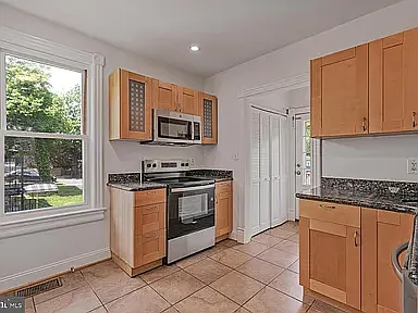 Kitchen with granite countertops and updated stainless steel appliances