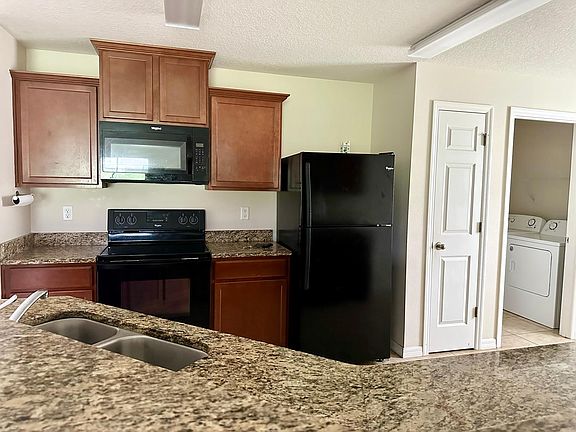 Eat In Kitchen features granite, pantry and breakfast bar